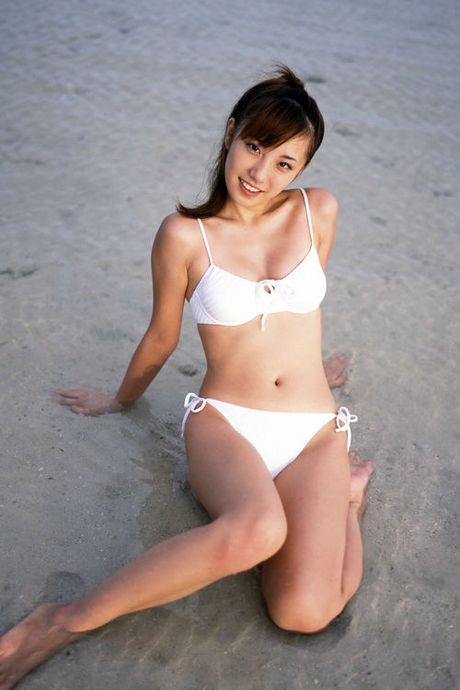Cute gravure idol with a perfect figure in a little white dress