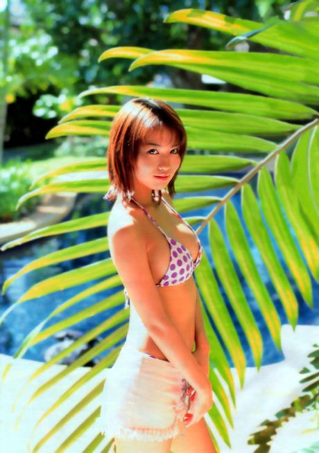 Sultry and sexy asian babe enjoying herself in her bikini