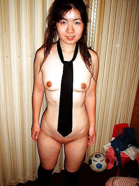 Asian schoolgirl with tiny tits strips and shows her sexy butt and tits