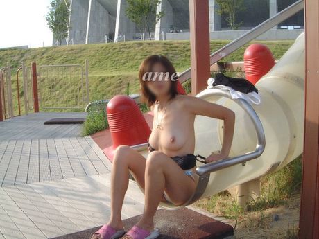 Asian schoolgirl with tiny tits strips and shows her hairy pussy outdoors