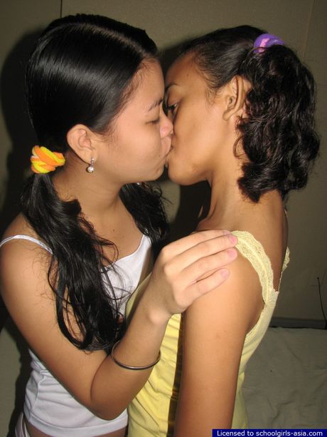 Two cute coeds spend some quality time together naked in a bed pleasuring their pussies