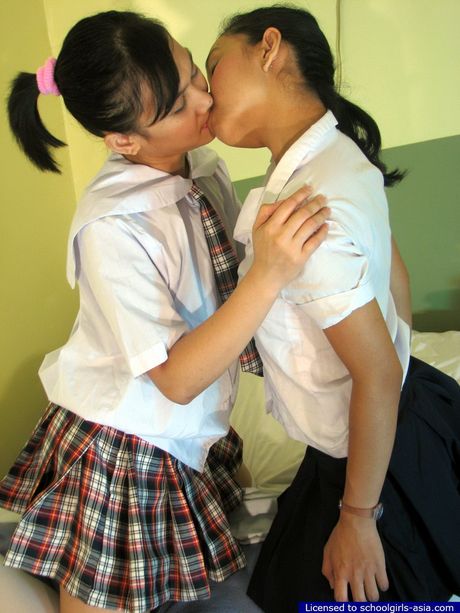 Two cute college students are engaged in a passionate mutual pussy eating session