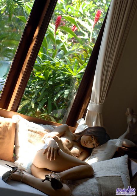 Asian teen is a nudist with an excellent body and a hairy inviting pussy