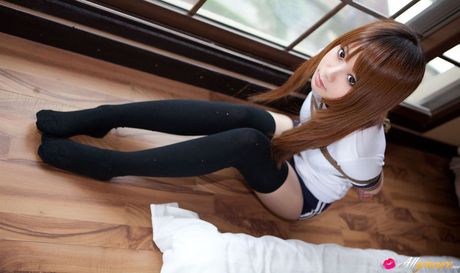 Dimdim Asian in long socks and sports outfit has hands tied