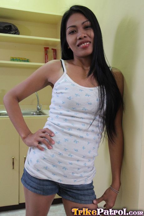 Asian teen Analyn strips and shows her hairy cunt and big butt