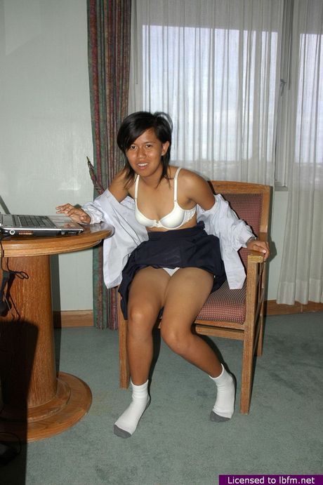 Asian amateur teen strips and unveils her tiny tits and pussy