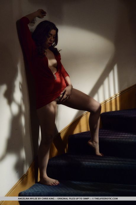 Platinum Asian babe Angelina Mylee demonstrates her sexy butt and tits in a solo