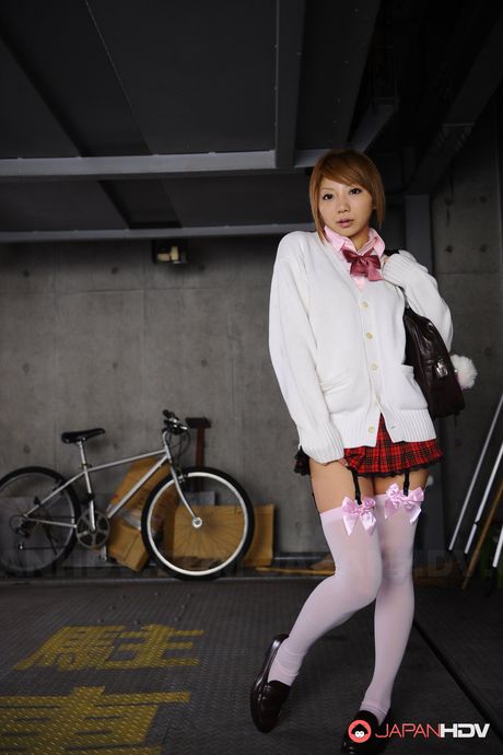 Cute school girl Rui Hazuki poses in her short uniform in parking lot