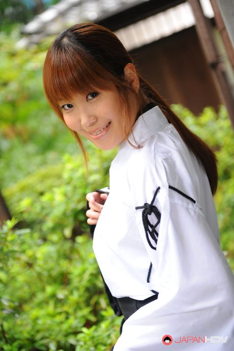 Cute teen girl Yuuno Hoshi enjoys in posing in her room for the camera