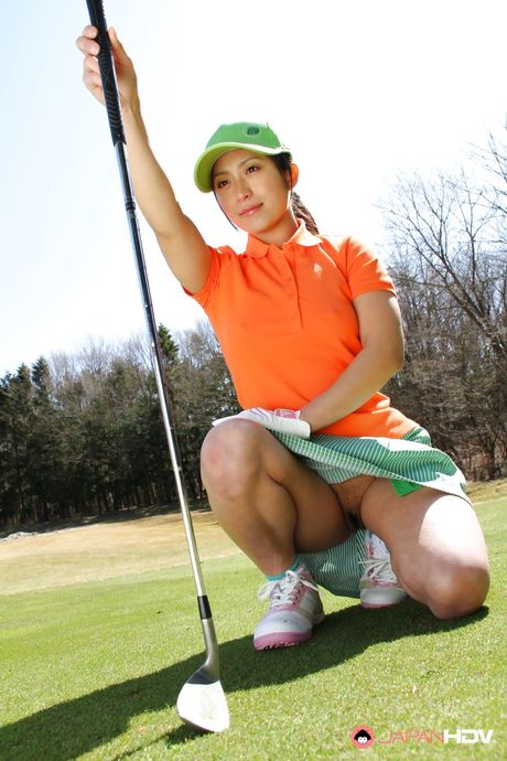 Deluxe japanese hottie Nana Kunimi posing in sexy skirt on camera outside