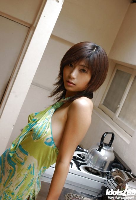 Charming japanese babe Rin Suzuka baring big tits and hot ass